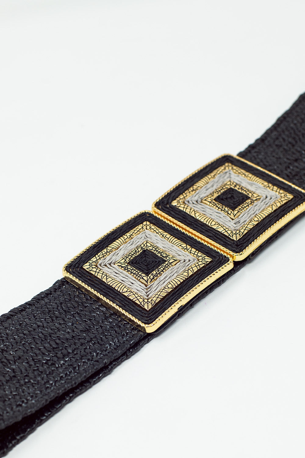 Black woven belt with square buckle with white and gold details