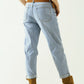 Boyfriend light blue jeans with stitching details on the edges