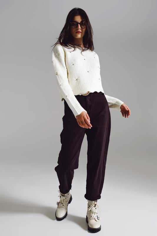 Brown relaxed pants with pocket detail at the waist