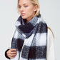 Q2 Checkerboard scarf in black and white with tassles