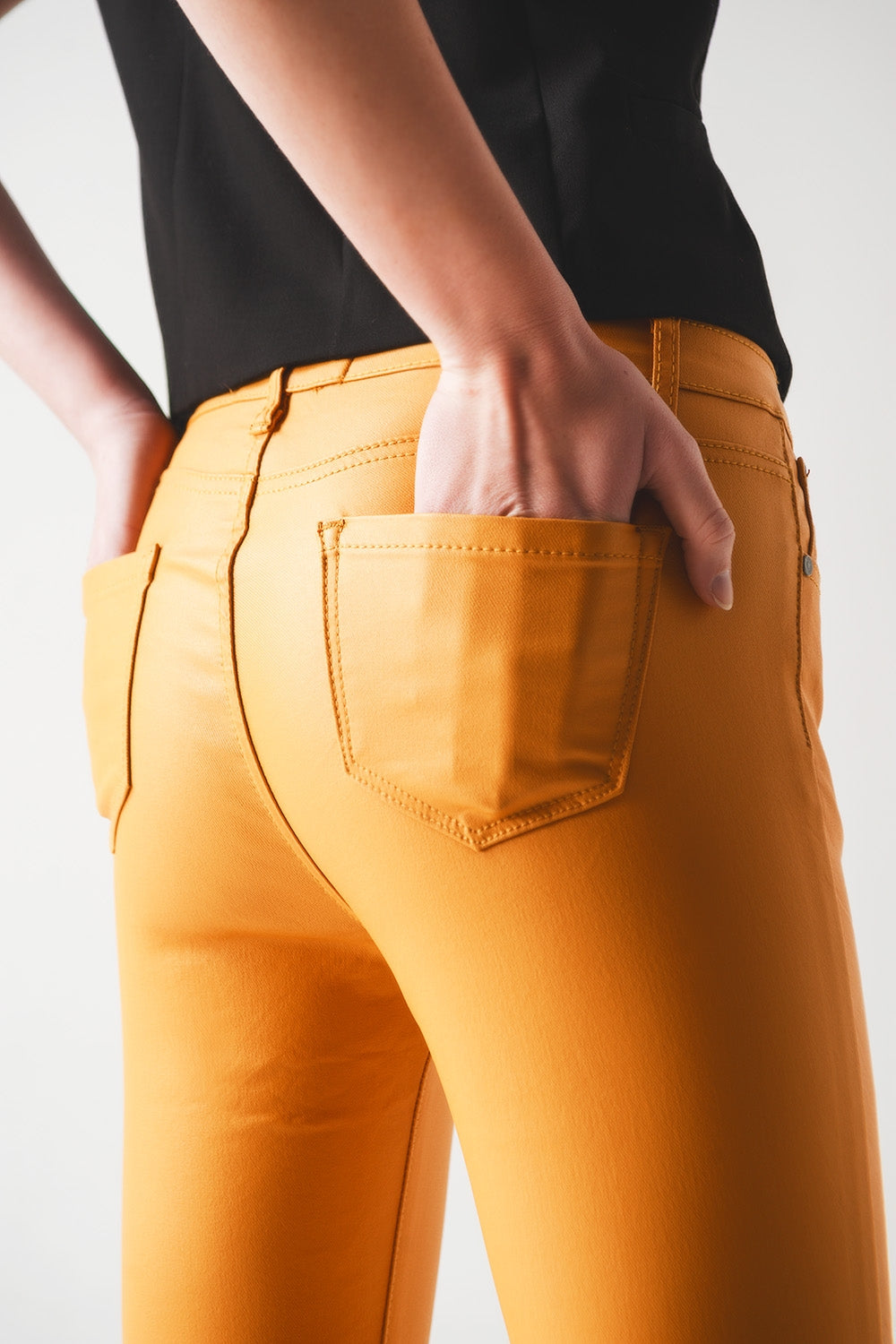 Coated pants in orange Szua Store