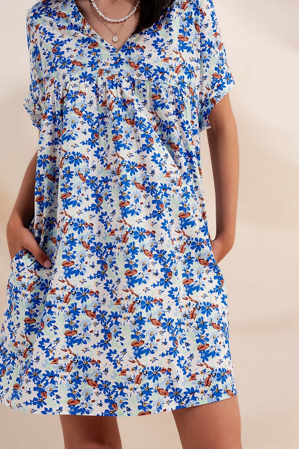 Cotton babydoll mini dress in blue floral Szua Store