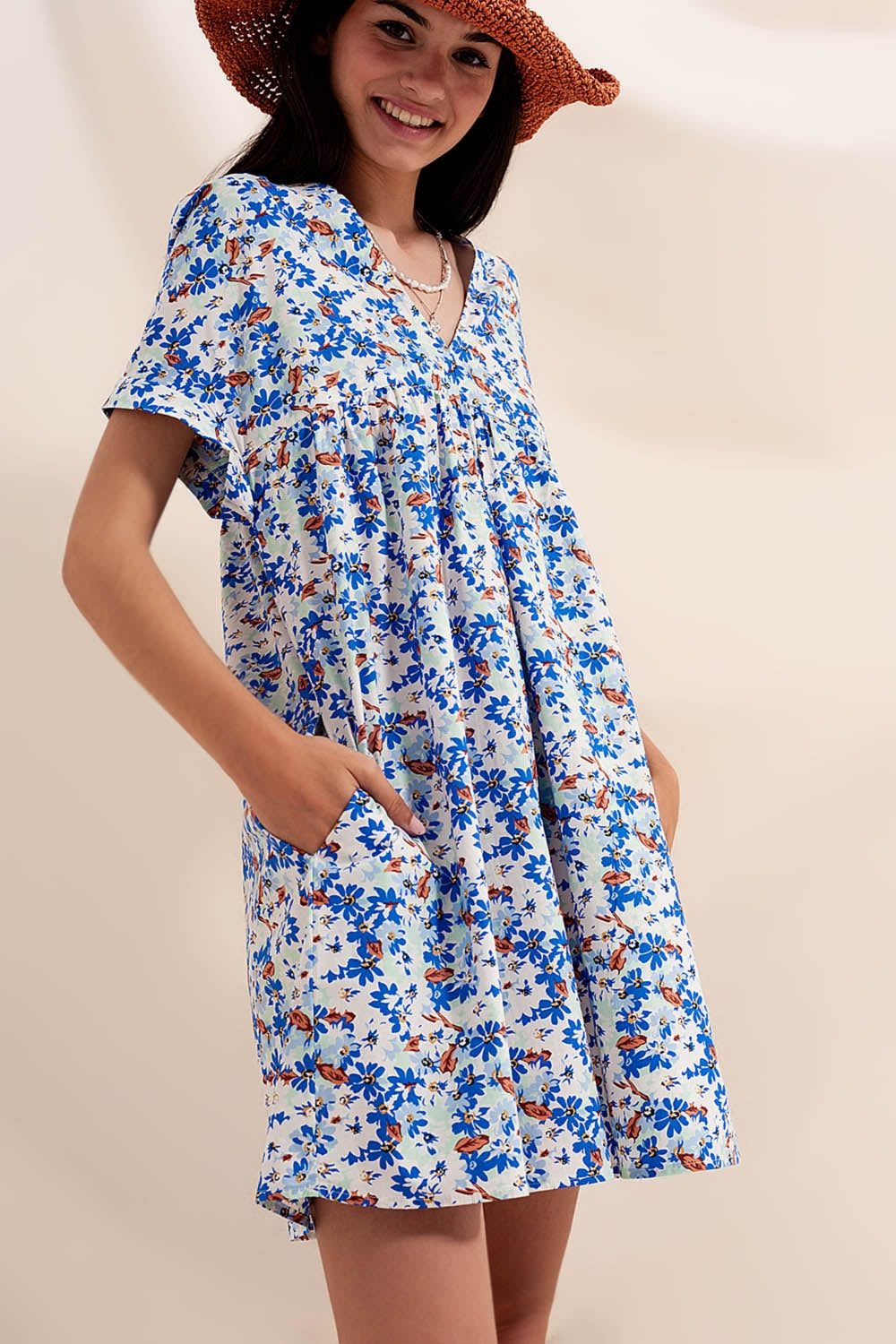 Cotton babydoll mini dress in blue floral Szua Store