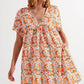 Cotton babydoll mini dress in orange floral Szua Store