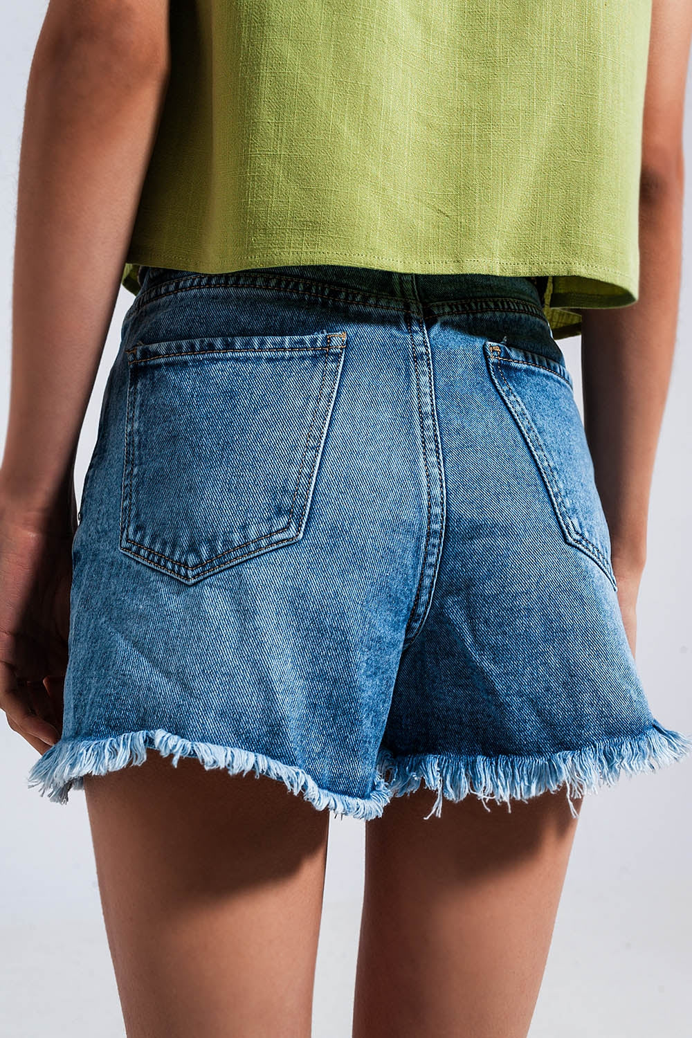 Cotton denim shorts with raw hem in mid blue Szua Store