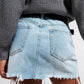 Denim button through mini skirt in light blue Szua Store