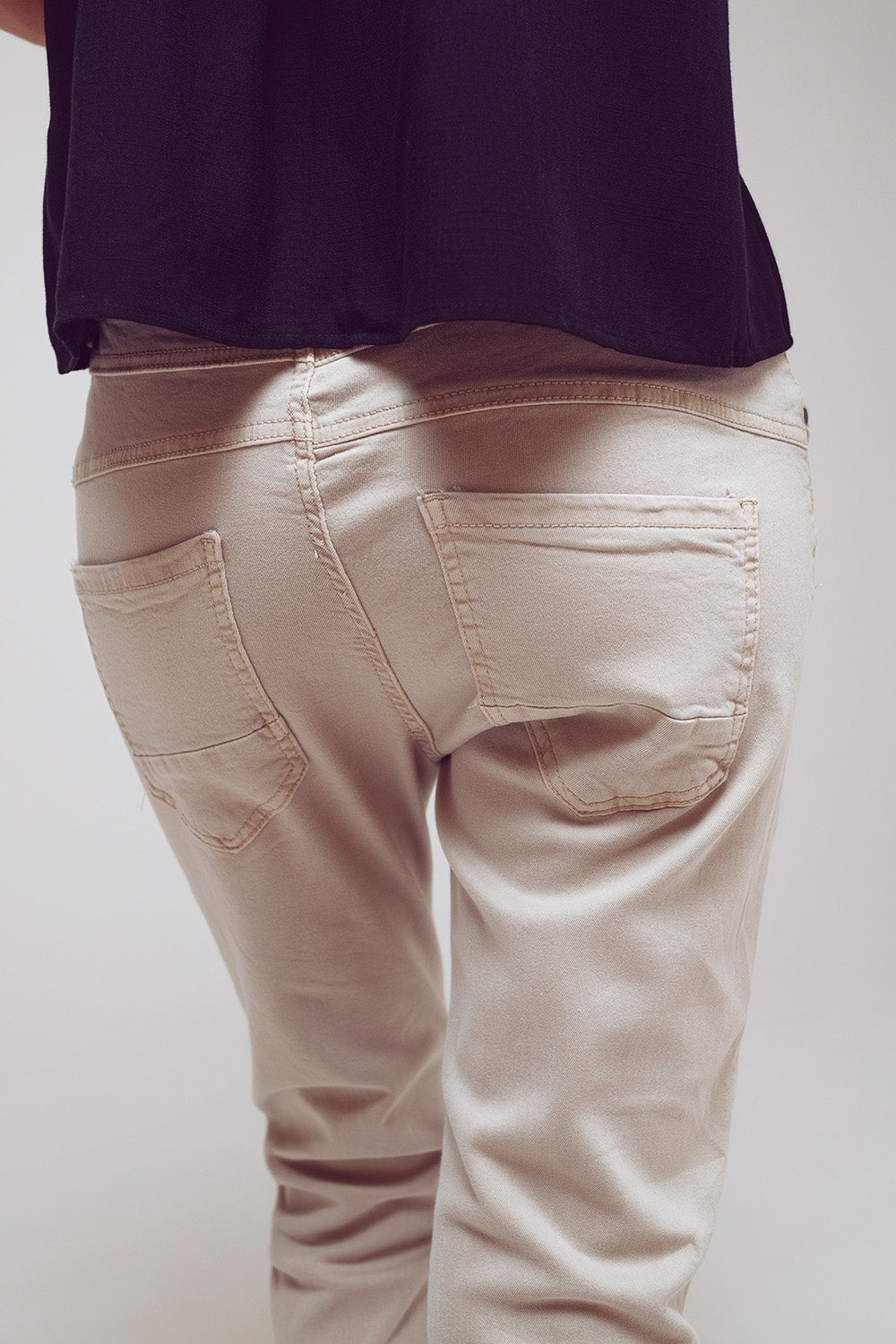 Exposed buttons skinny jeans in beige - Szua Store