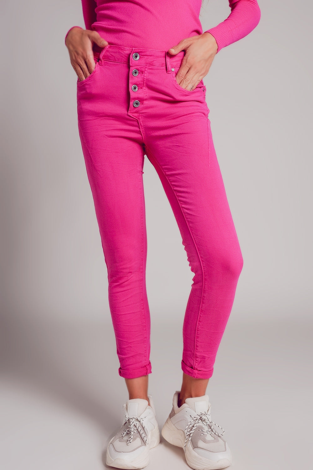 Exposed buttons skinny jeans in fuchsia Szua Store
