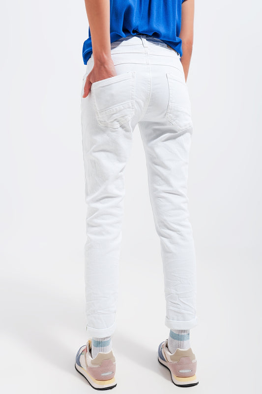 Exposed buttons skinny jeans in white Szua Store