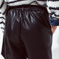 Faux leather oversized shorts with pleat down the front and pockets in black