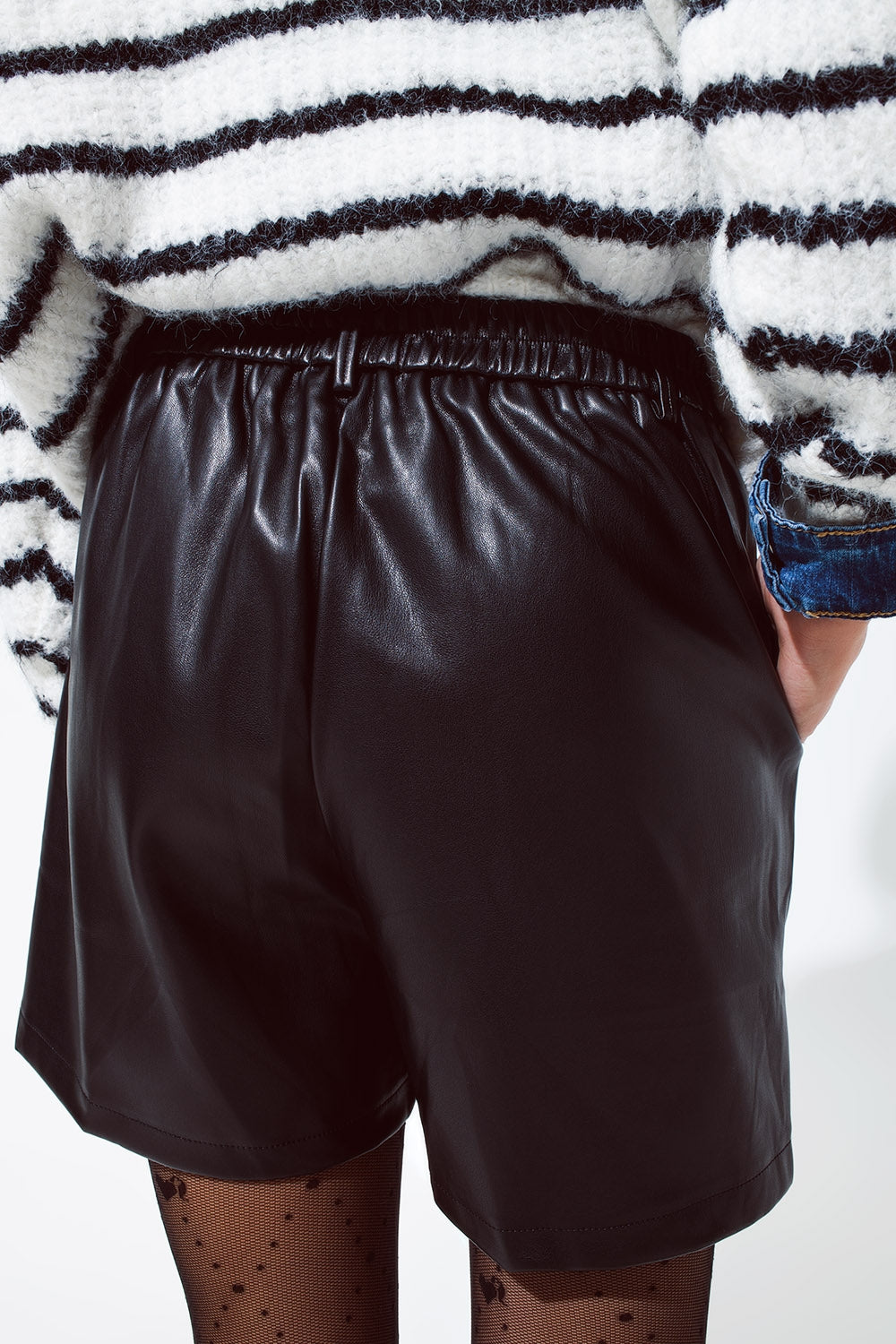 Faux leather oversized shorts with pleat down the front and pockets in black