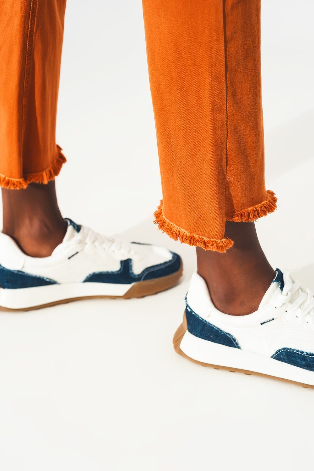 Flare jeans with raw hem edge in orange - Szua Store