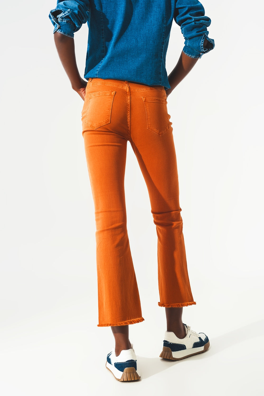 Flare jeans with raw hem edge in orange - Szua Store