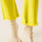 Flare jeans with raw hem edge in yellow - Szua Store