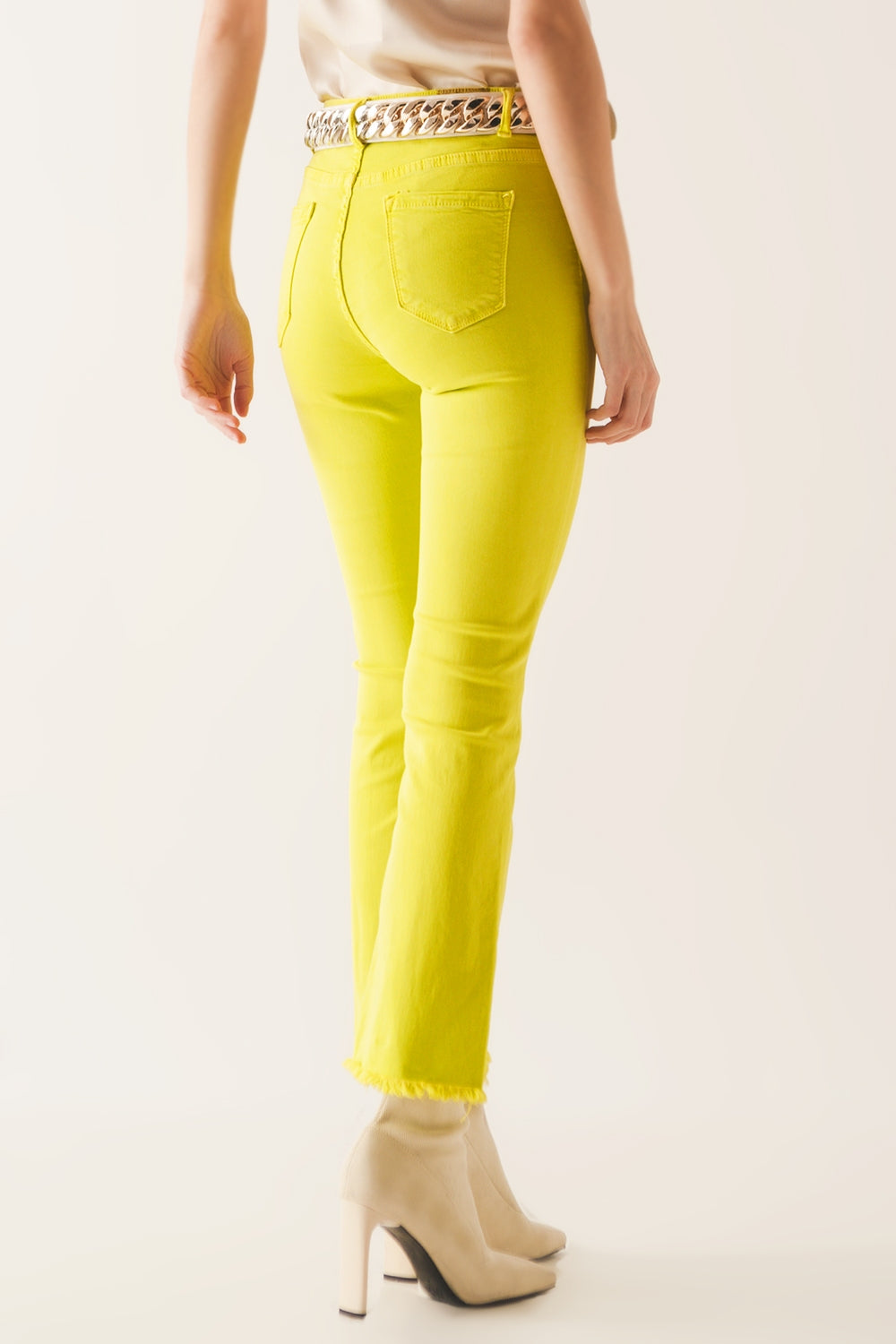 Flare jeans with raw hem edge in yellow - Szua Store