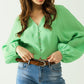 Q2 Green blouse with balloon sleeves and frontal closure with buttons