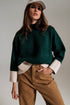 Q2 green jumper with white ribbed cuffs and hem