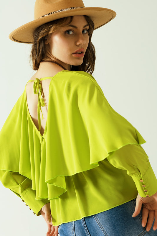 Green long sleeve top with a ruffle detail and bare back