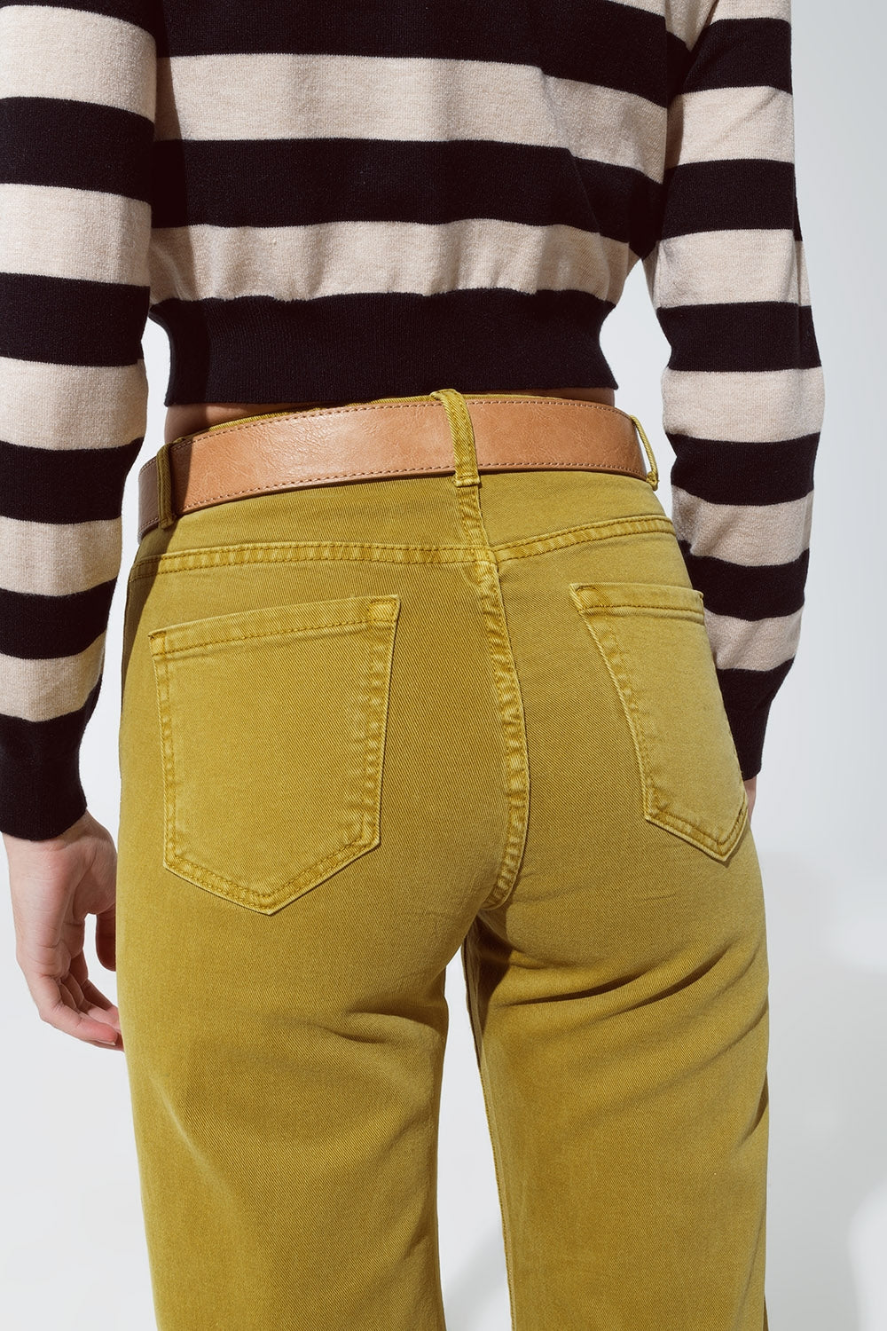 Green straight leg jeans with gold metallic glow