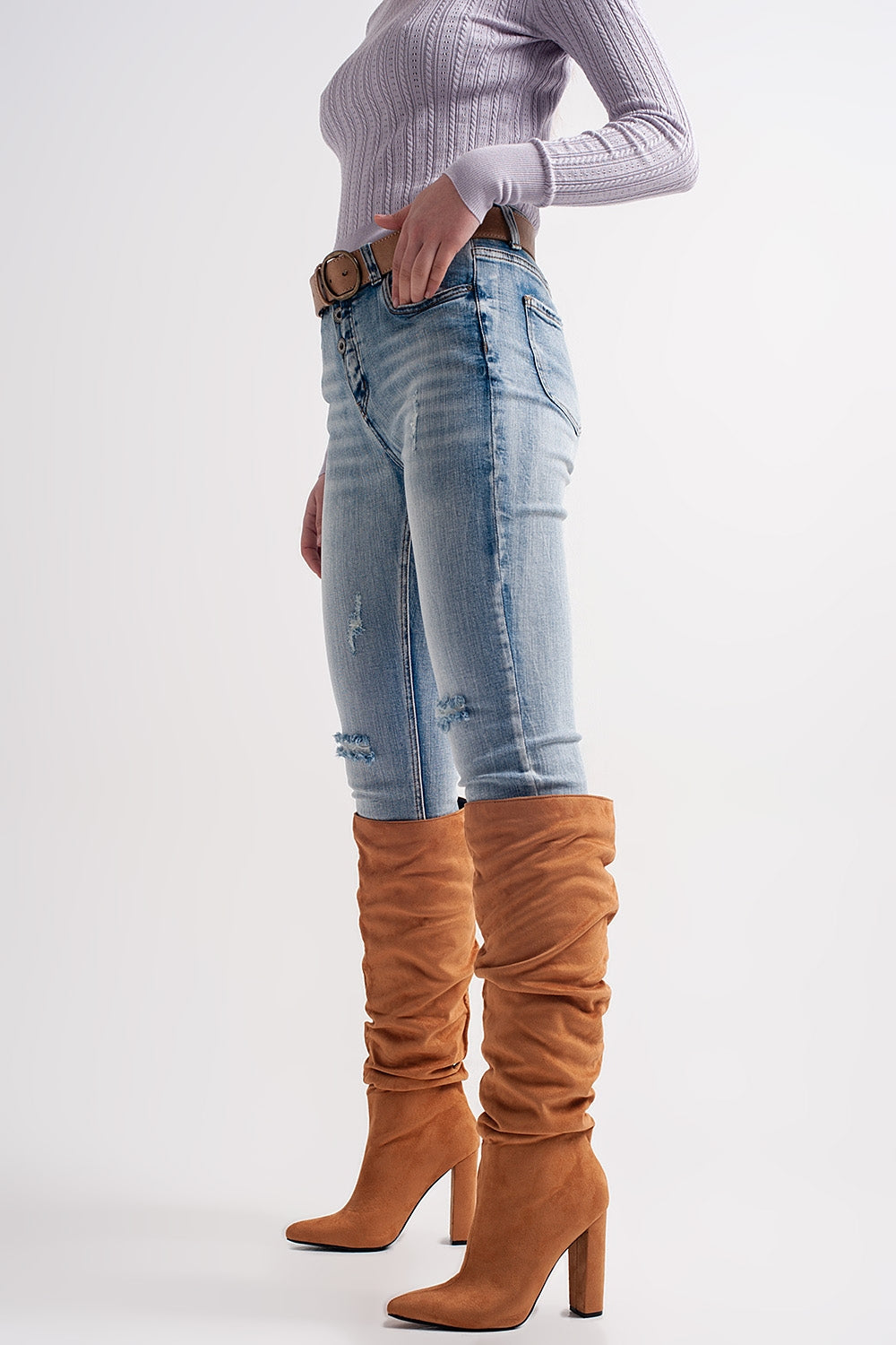 Heather skinny leg distressed jeans with button detail in light blue Szua Store