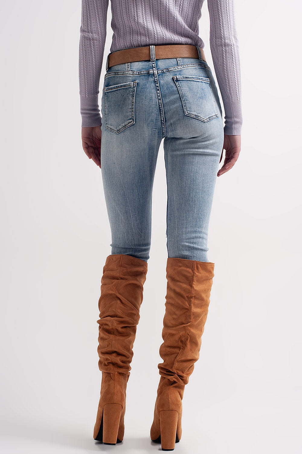 Heather skinny leg distressed jeans with button detail in light blue Szua Store
