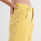 High rise mom jeans with pleat front in yellow Szua Store