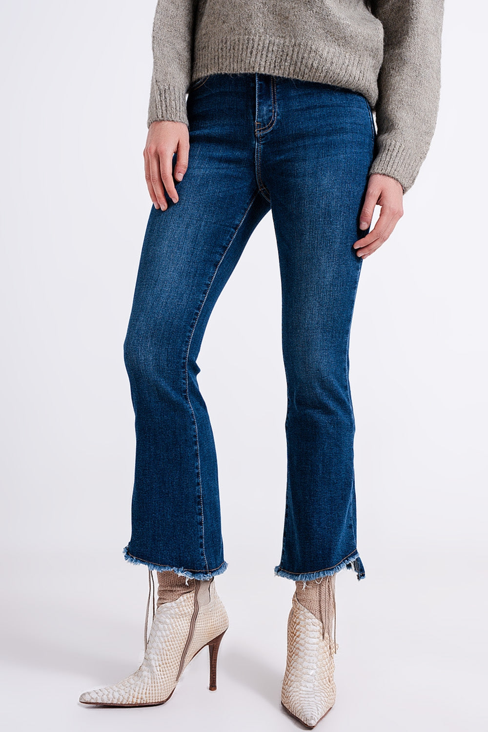 High waisted jeans with asymmetrical hem