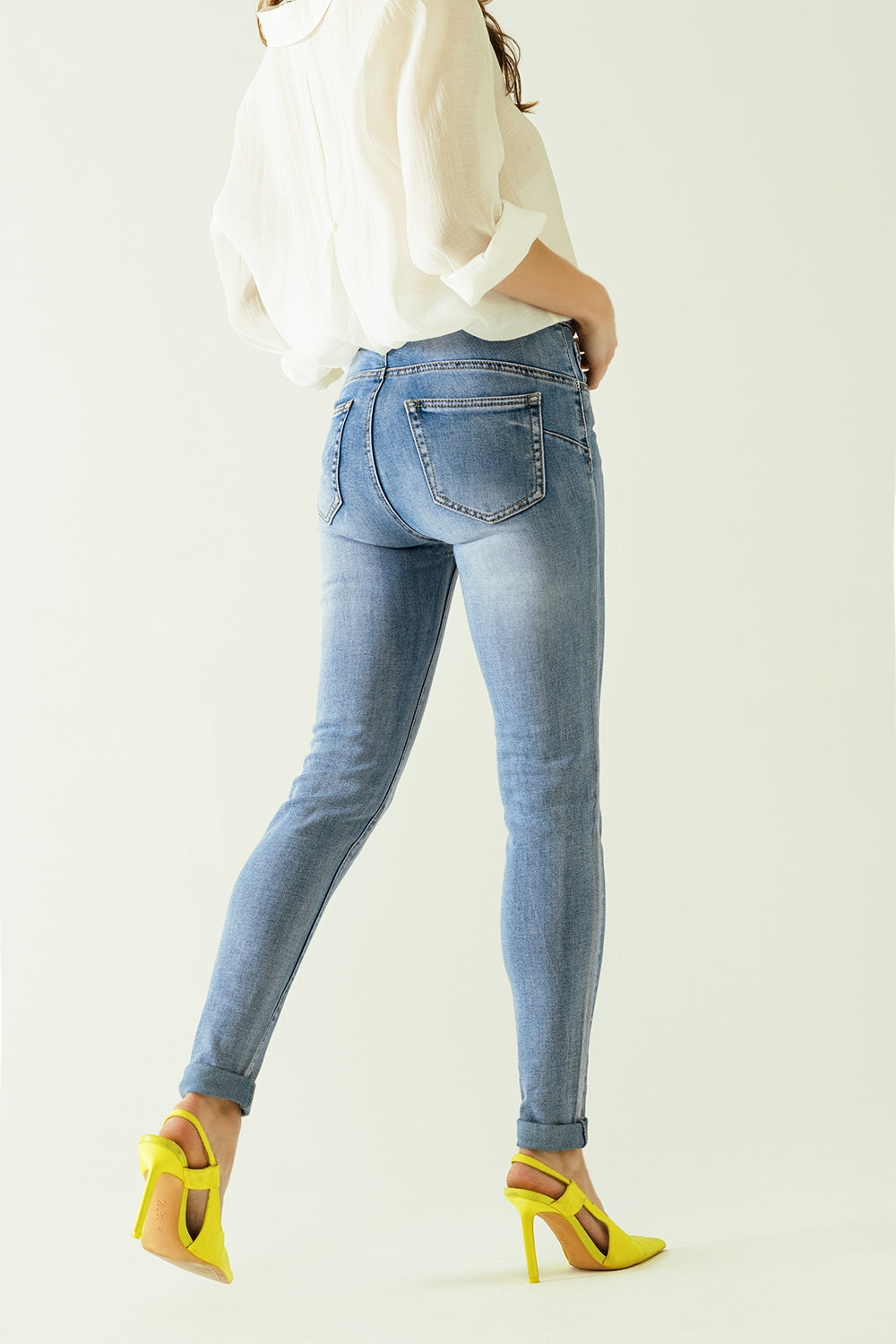 High-waisted jeans with five pockets with silver powder-coated effect