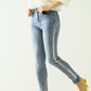 High-waisted jeans with five pockets with silver powder-coated effect