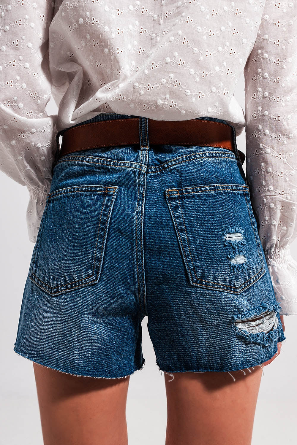 High waisted ripped denim shorts in mid wash Szua Store