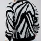 Knitted jumper in black zebra print Szua Store