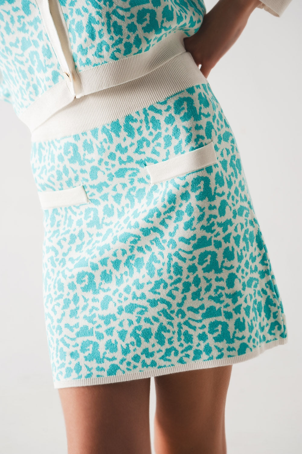 Lightweight knit mini skirt in turquoise animal print Szua Store