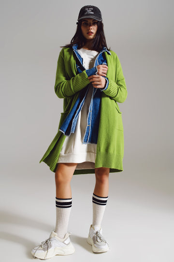 Q2 Long green cardigan with folded pockets