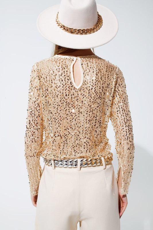 Long sleeve gillter top in gold