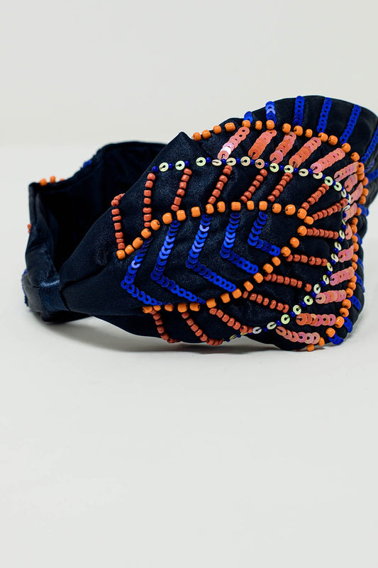 Navy blue headband with sequin and rhinestone embellishments