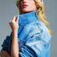Ovesized cropped denim jacket with zip fastening and high collar