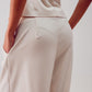 Pleated wide leg pants in cream Szua Store