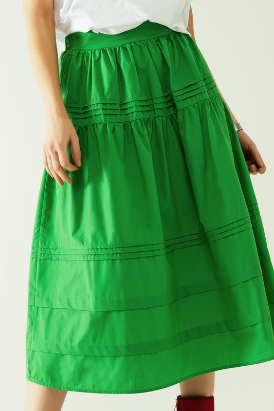 Falda midi de popelina escalonada con detalles de costuras en verde