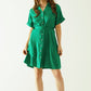 Relaxed belted mini dress with button placked down the front in green