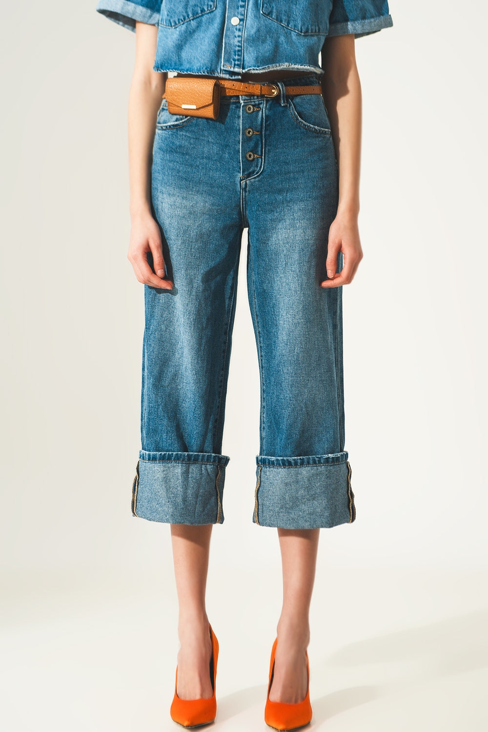 Relaxed jeans with rolled hem and exposed buttons in blue - Szua Store
