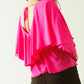 Ruffled V-neck top with buttoned cuffs and tie in the back detal in fuchsia