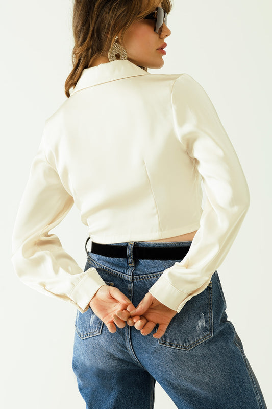 Satin V-neck cream crop top with long sleeves and frontal pockets