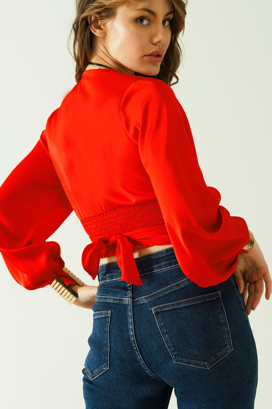 Short red crop top with long and wide sleeves
