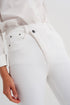 Slim jeans with asymmetric button in cream Szua Store