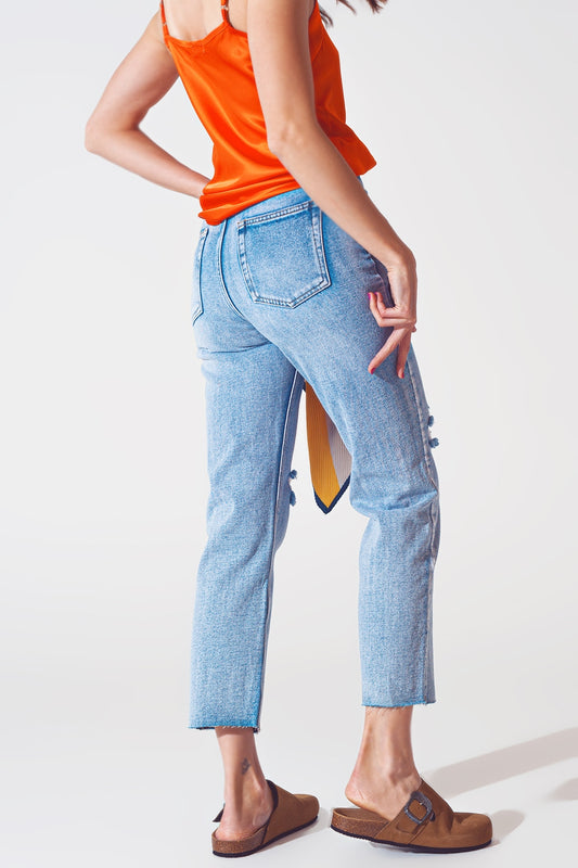 Sraight-leg jeans with exposed buttons and ripped knees in light wash - Szua Store