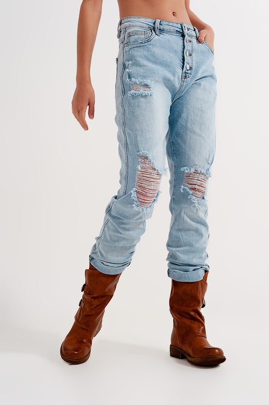 Straight leg distressed jeans with button detail in light blue Szua Store