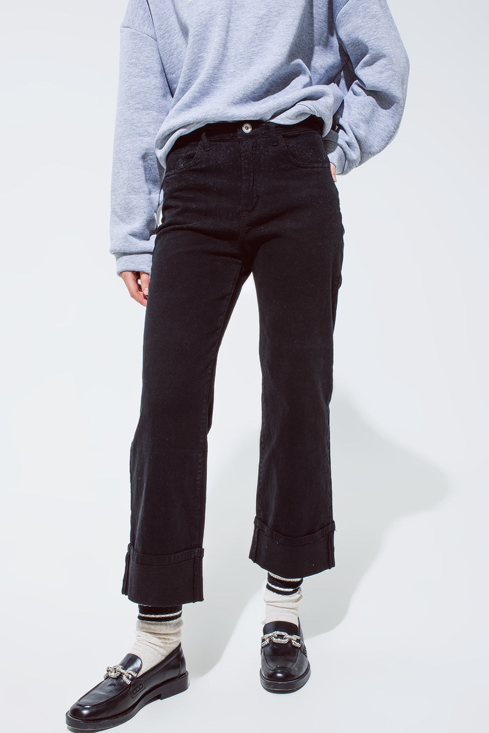 Q2 Straight leg jeans in black with folded trouser legs