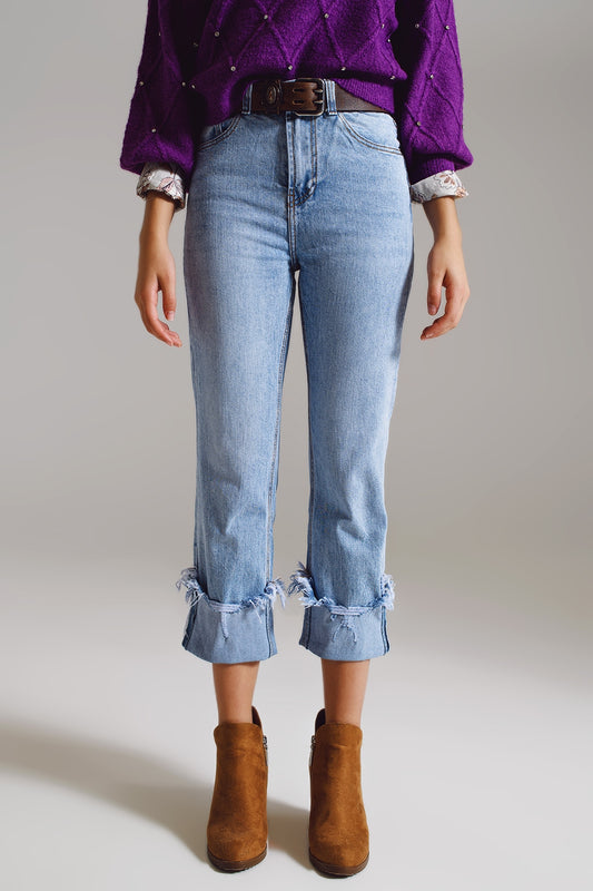 Straight leg jeans with distressed hem in light blue