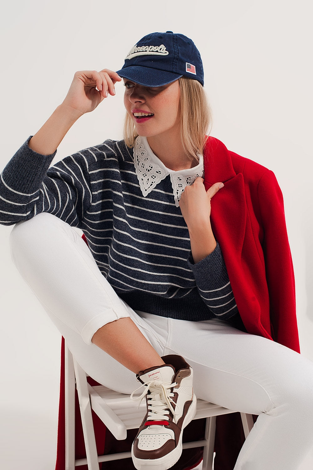 Striped knitted sweater with wrangler sleeves blue and white