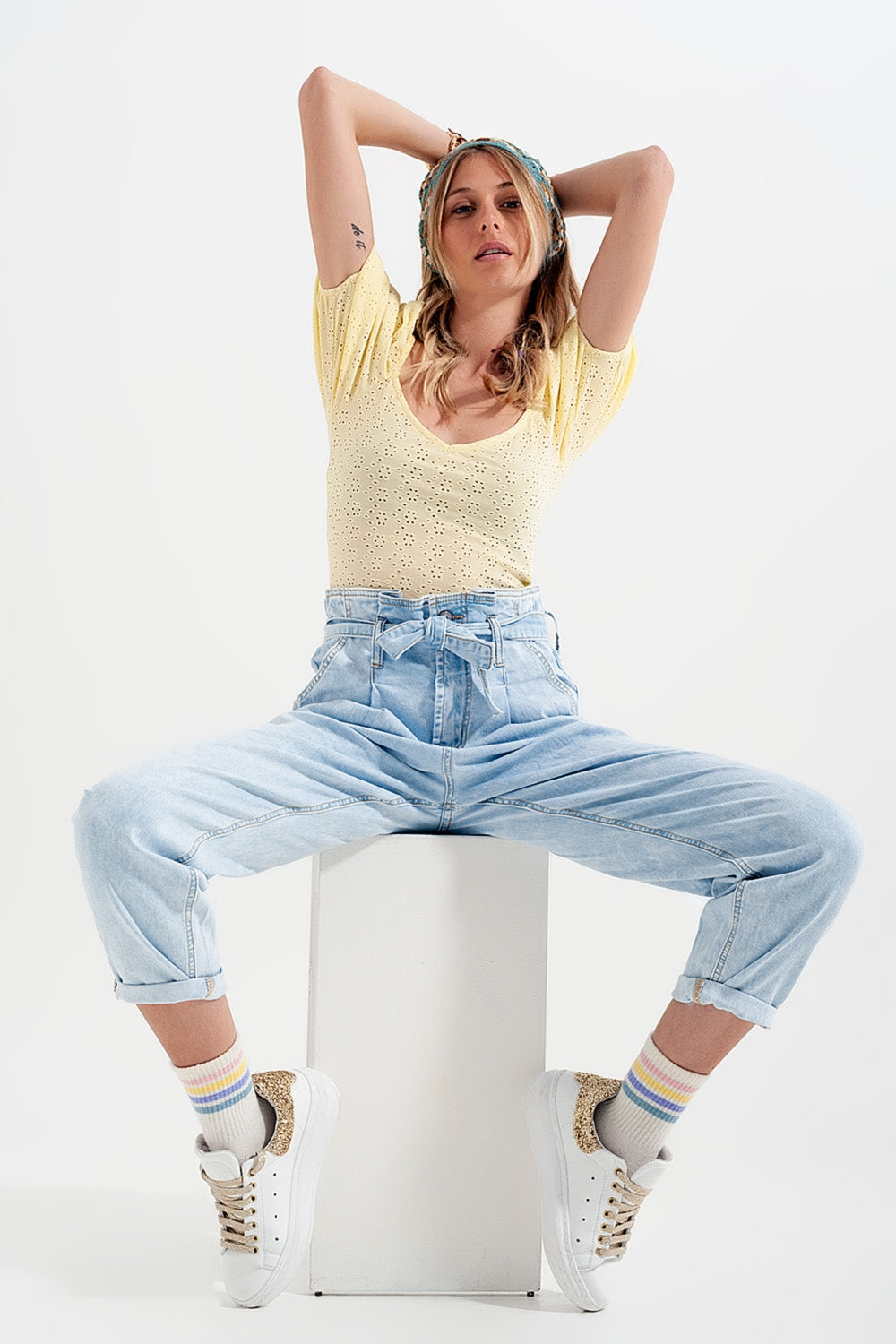Tapered leg jeans with paper bag waist in light vintage wash